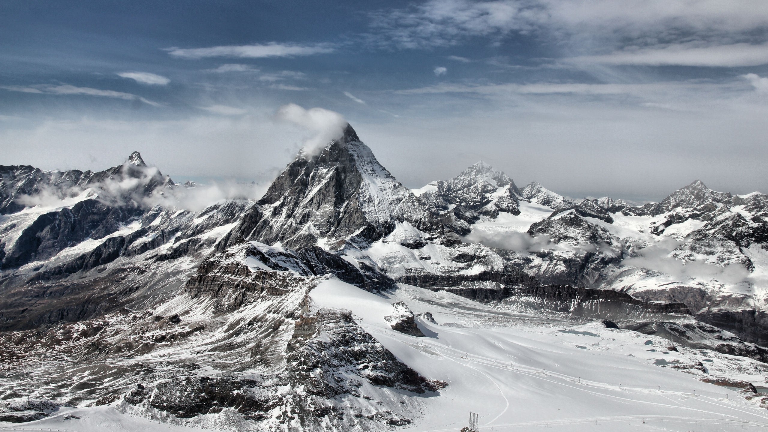 2560x1440 Wallpaper landscape, winter, mountain, peak, top, clouds, white 2560x1440